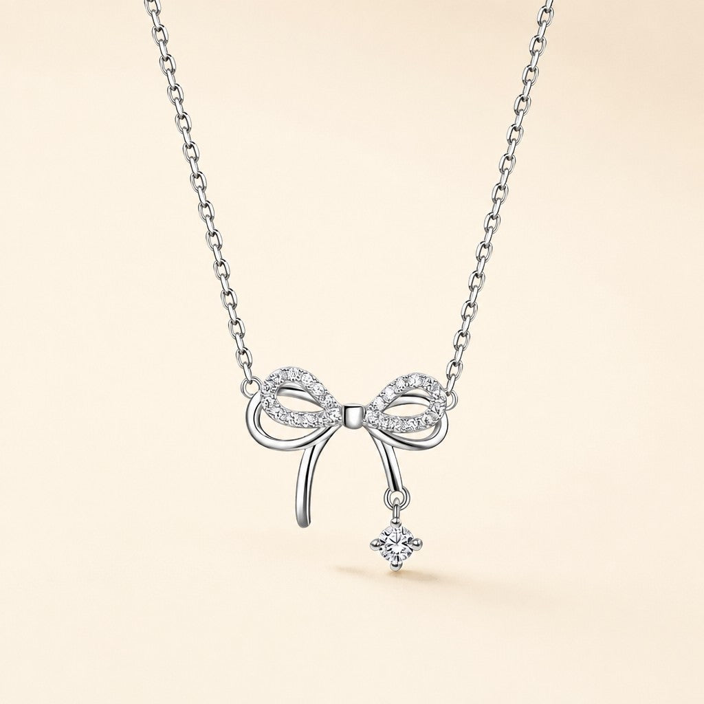 Shiny Silver Bow Necklace — cream