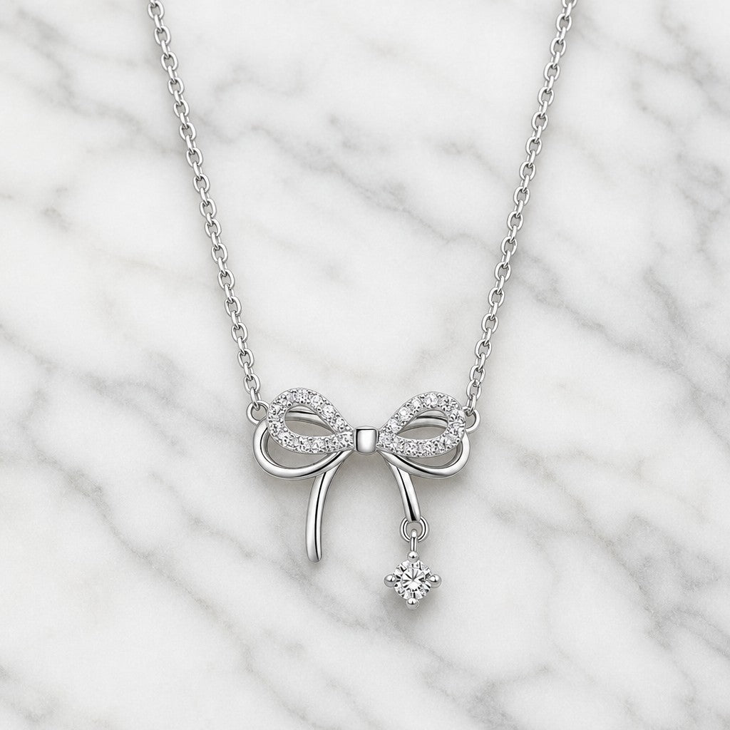 Shiny Silver Bow Necklace — marble
